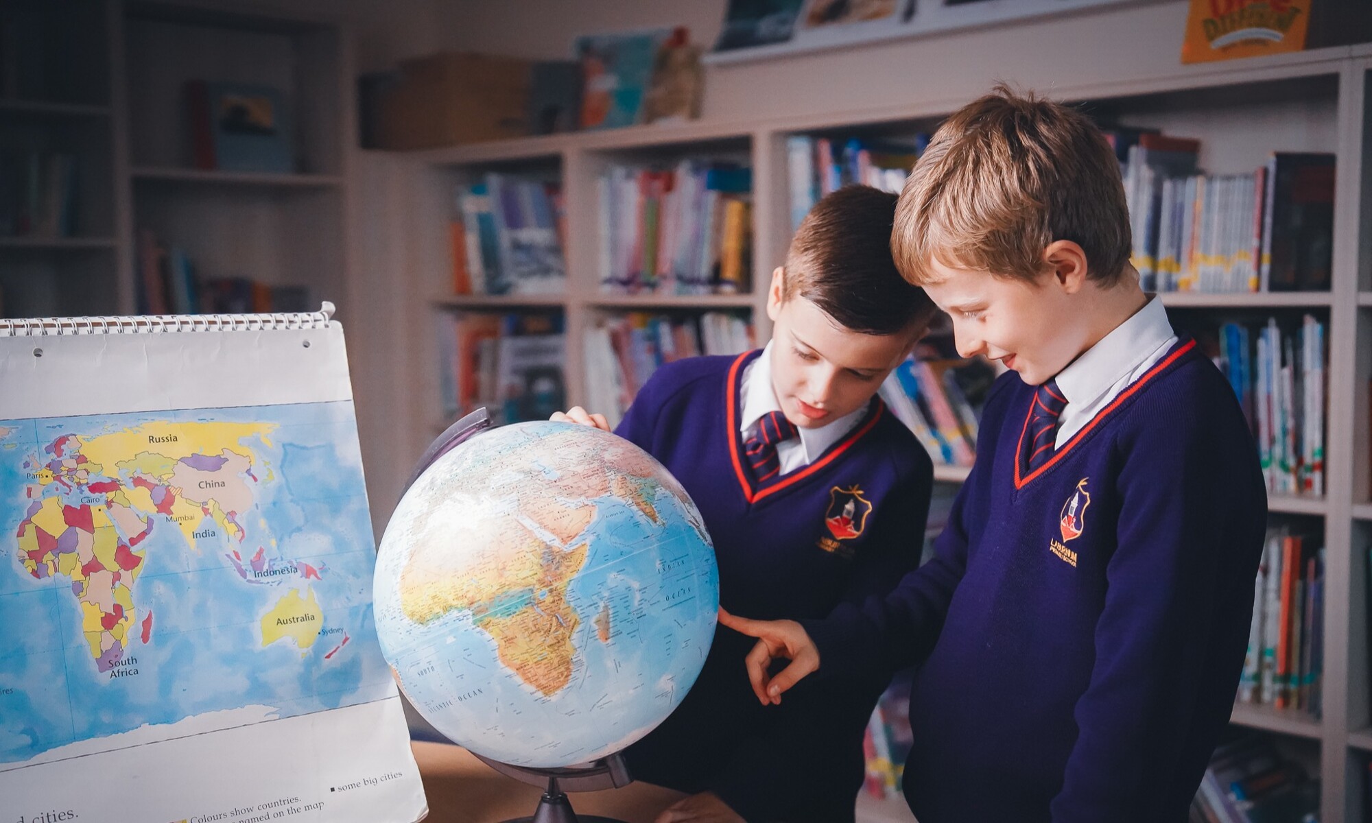 Laburnam students with a globe